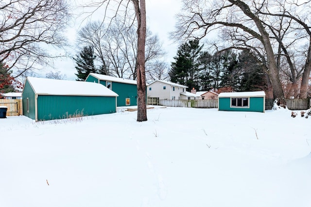 snowy yard with an outdoor structure