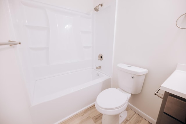 full bathroom featuring wood-type flooring, toilet, vanity, and bathing tub / shower combination