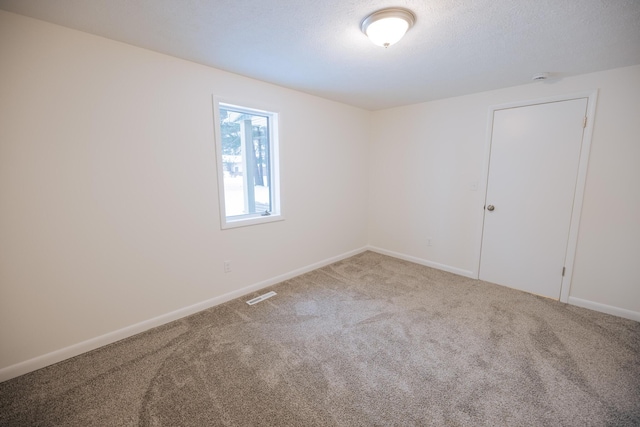 unfurnished room with carpet