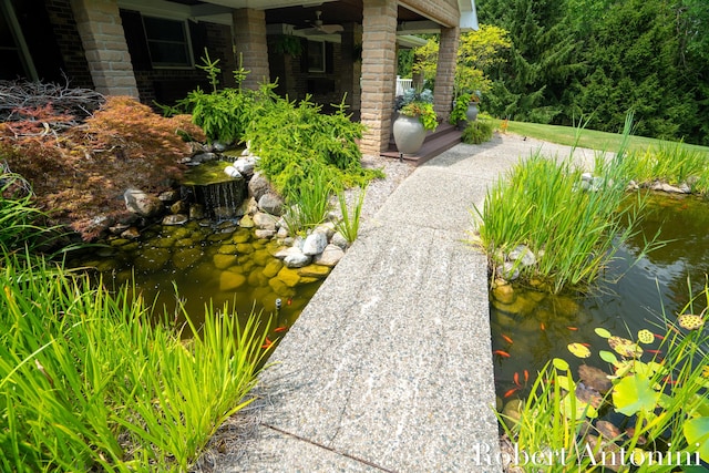 exterior space with a small pond