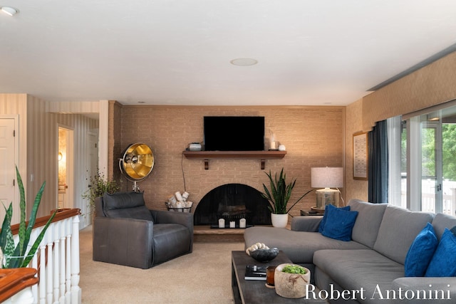 living room featuring a brick fireplace and light colored carpet