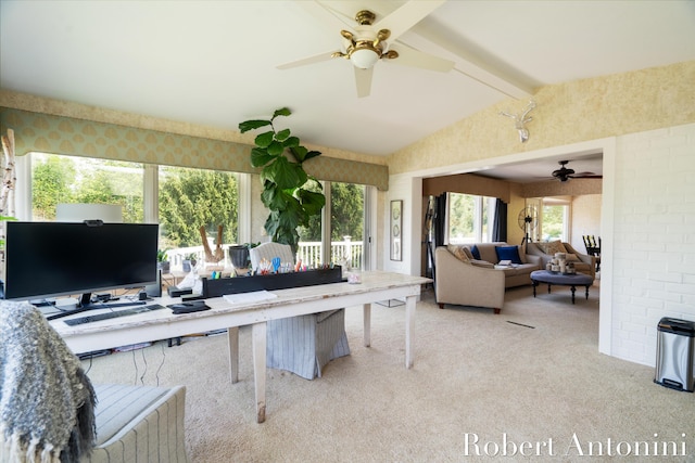 carpeted office space featuring lofted ceiling with beams