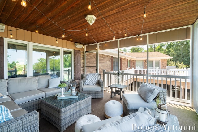 sunroom / solarium with wood ceiling and an AC wall unit