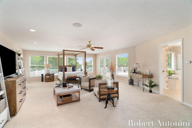 living room with light carpet and ceiling fan