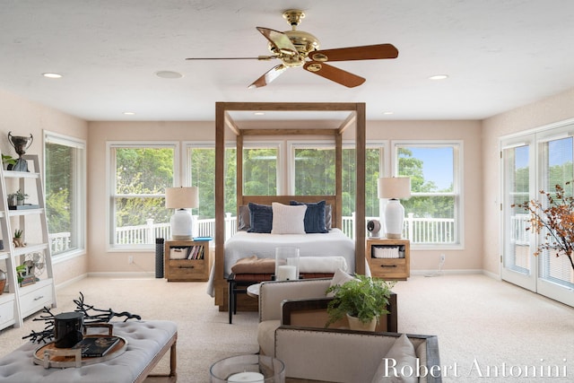 carpeted bedroom featuring ceiling fan and access to outside