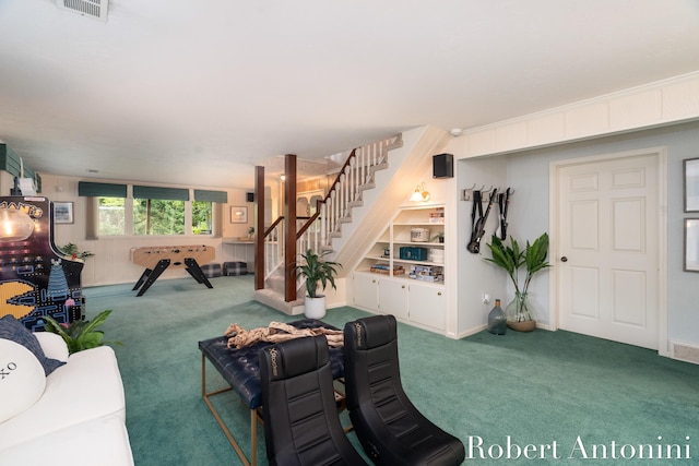 living room featuring carpet and built in shelves