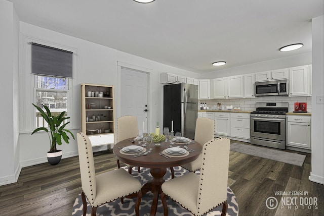 dining area with dark wood-type flooring