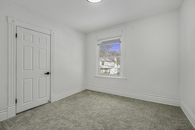 unfurnished room with carpet flooring