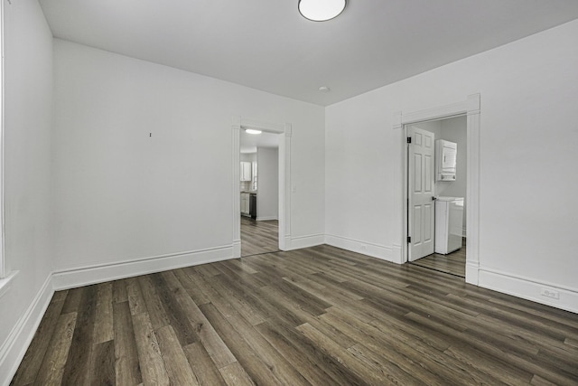 spare room featuring dark wood-type flooring