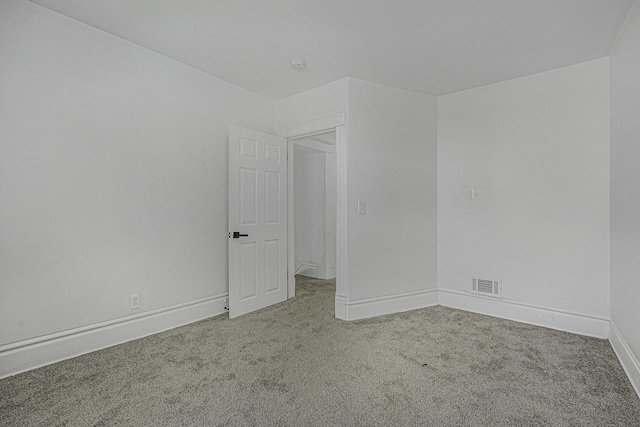 spare room featuring carpet floors