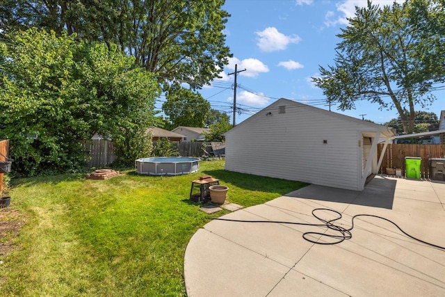 exterior space featuring a patio area and a fenced in pool