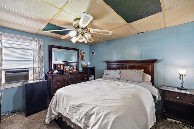 carpeted bedroom with ceiling fan and cooling unit