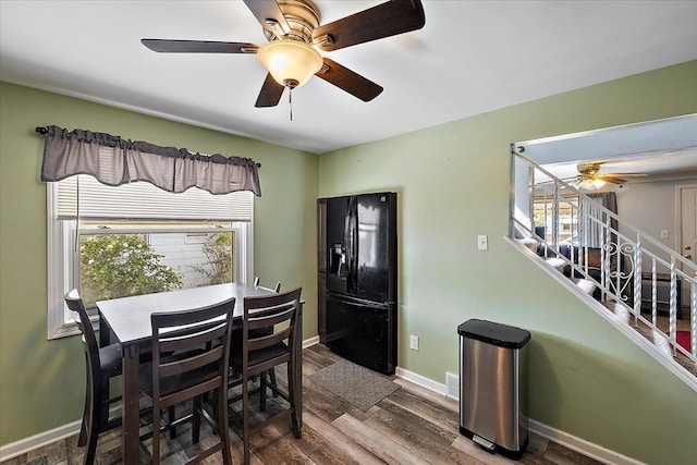 dining area featuring a wealth of natural light and hardwood / wood-style floors