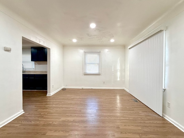 empty room featuring hardwood / wood-style flooring