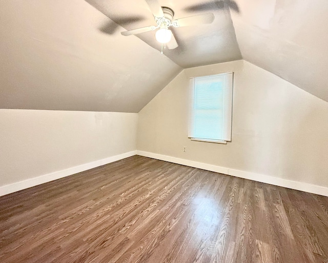 additional living space with ceiling fan, dark hardwood / wood-style flooring, and lofted ceiling