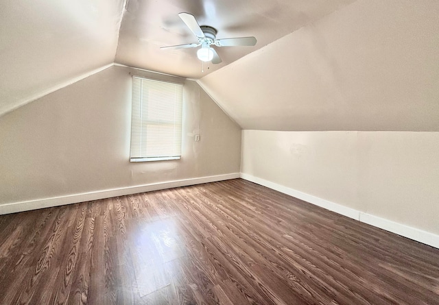 additional living space featuring ceiling fan, dark hardwood / wood-style floors, and vaulted ceiling