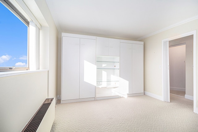 unfurnished bedroom with light carpet and ornamental molding