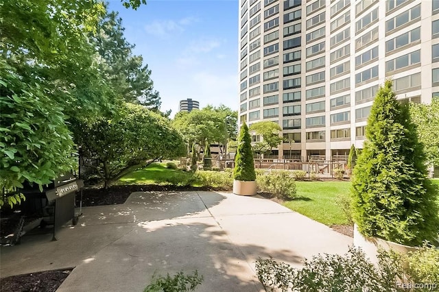 surrounding community featuring a patio area and a yard