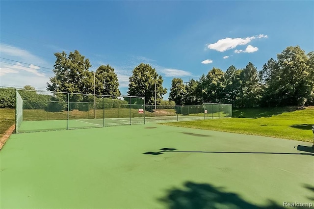 view of property's community with tennis court