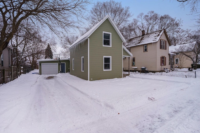 view of front of home featuring an outdoor structure and a garage