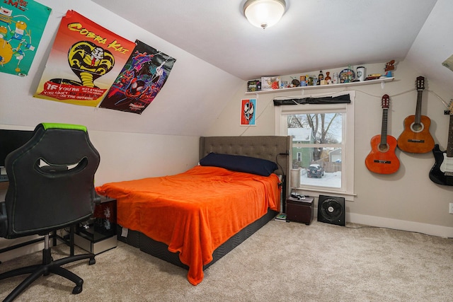 bedroom with light colored carpet and vaulted ceiling