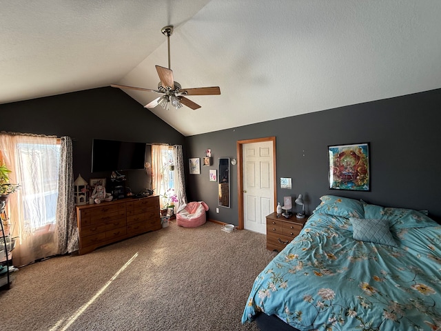 carpeted bedroom with ceiling fan and vaulted ceiling