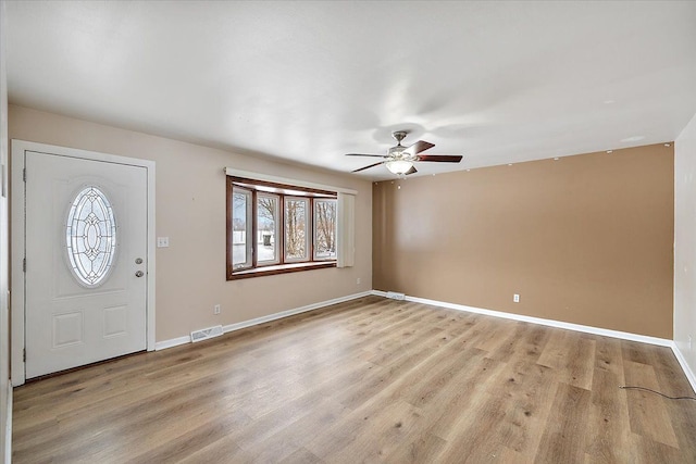 foyer entrance featuring ceiling fan and light hardwood / wood-style floors