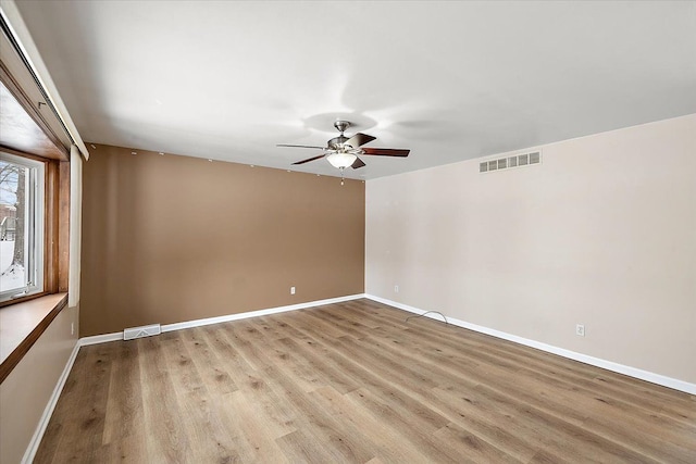 unfurnished room with ceiling fan and light hardwood / wood-style flooring