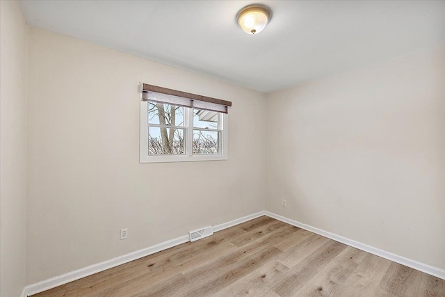 empty room with light wood-type flooring