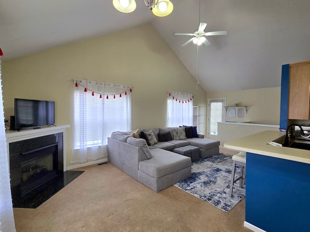 living room featuring light carpet, ceiling fan, high vaulted ceiling, and sink