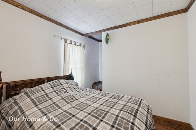 bedroom featuring crown molding