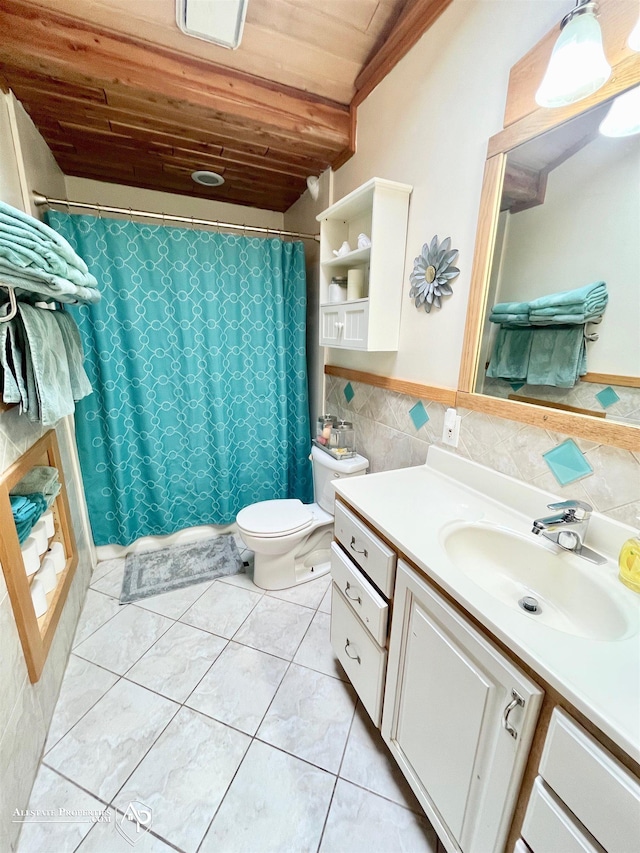 bathroom with toilet, vanity, tile patterned flooring, tile walls, and wooden ceiling