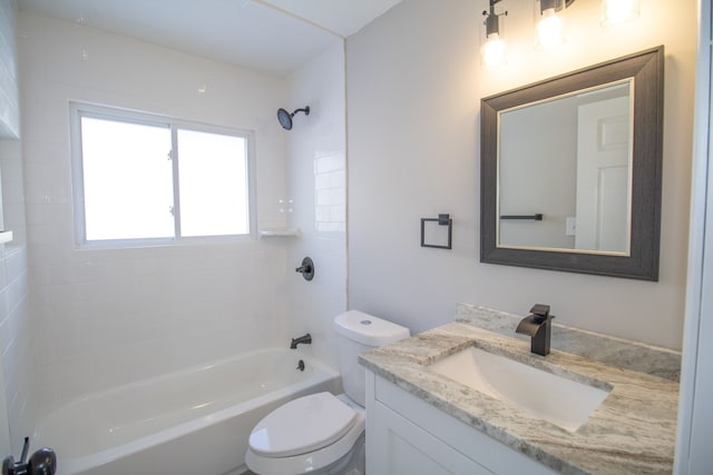 full bathroom featuring toilet, tiled shower / bath, and vanity