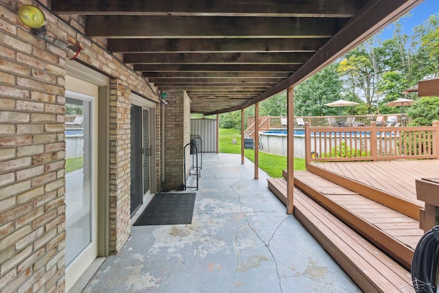 view of patio / terrace with a pool side deck