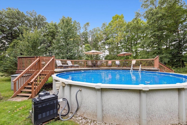 view of swimming pool featuring a wooden deck