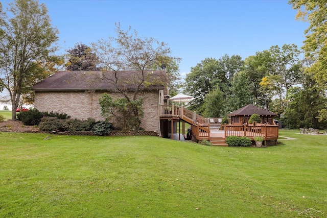 view of yard with a deck and a gazebo