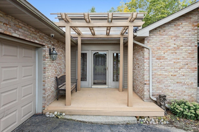 view of exterior entry featuring a garage