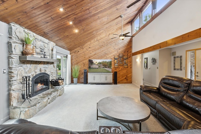 living room with high vaulted ceiling, ceiling fan, a fireplace, and light carpet