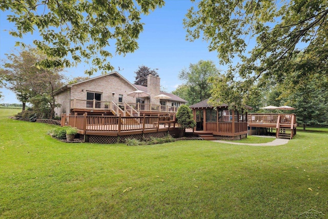 view of yard featuring a gazebo and a wooden deck