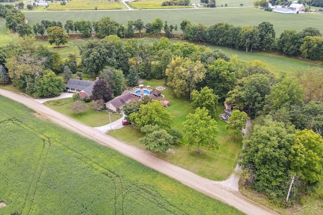 birds eye view of property with a rural view