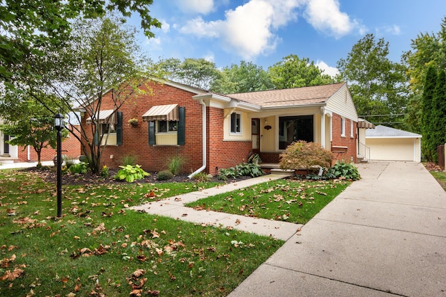 ranch-style home with a front yard, an outdoor structure, and a garage