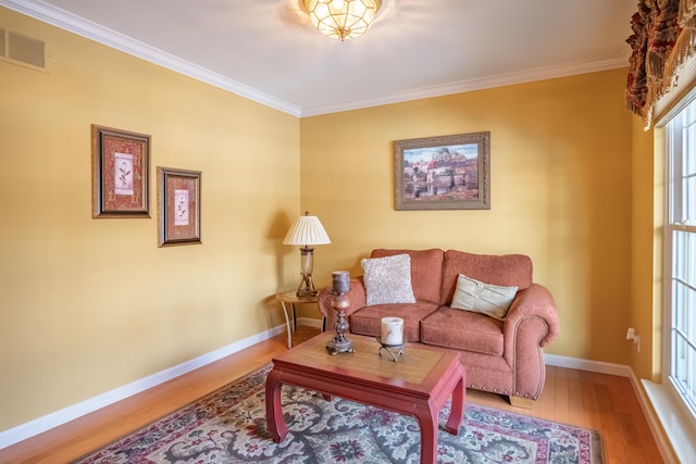 living room featuring wood-type flooring and crown molding