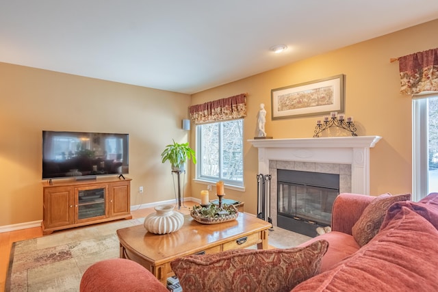 living room with a tiled fireplace