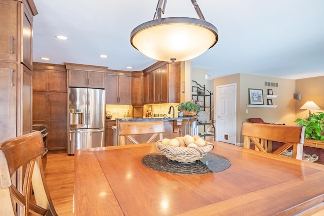 dining area with light wood-type flooring