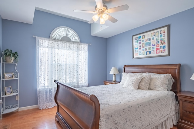 bedroom featuring ceiling fan and hardwood / wood-style floors