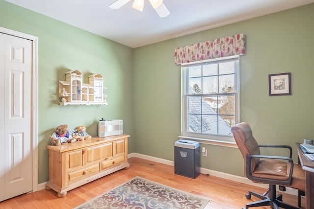 office area featuring ceiling fan, a wealth of natural light, and wood-type flooring