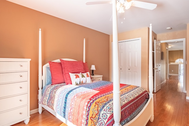 bedroom with a closet, ceiling fan, and wood-type flooring