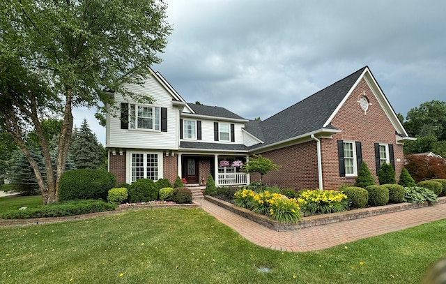 front facade featuring a front yard and a porch