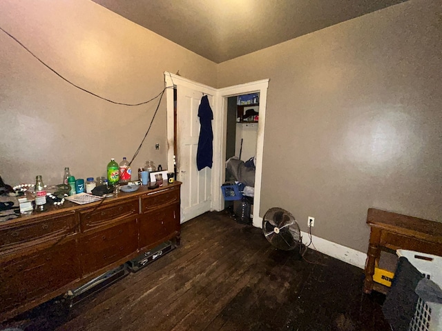 bedroom featuring dark wood-type flooring