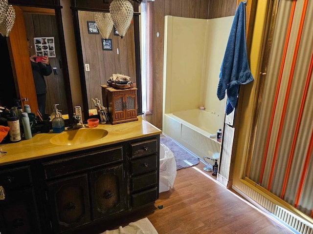 3593 Southern Dr, Hart, MI 49420 - bathroom with vanity, wood-type flooring, and bathtub / shower combination